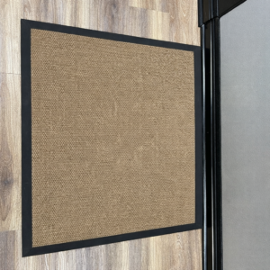 Plain tan berberpoint entrance mat with black rubber border