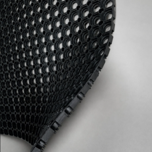 Black anti-trip safety ring mat with bevelled edges for slip-resistant and anti-fatigue workplace flooring.