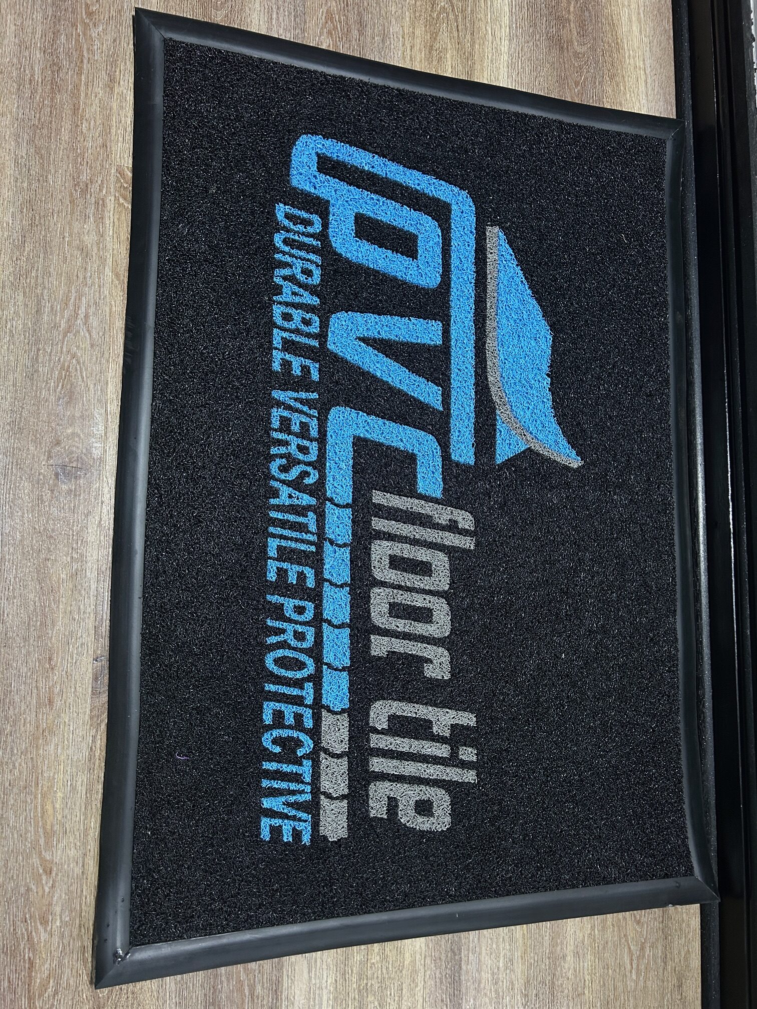 PVC vinyl loop “spaghetti” wet-area mat with PVC Floor Tile logo